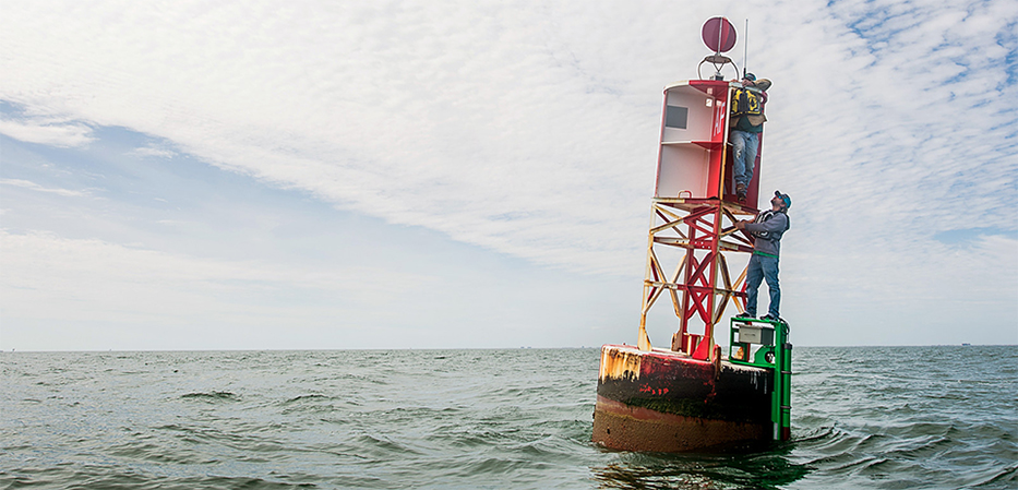 Crew from the Conrad Blucher Institute for Surveying and Science install a current meter on a U.S. Coast Guard Aids to Navigation buoy in Corpus Christi. (Credit from CBI, Texas A&M University-Corpus Christi) .